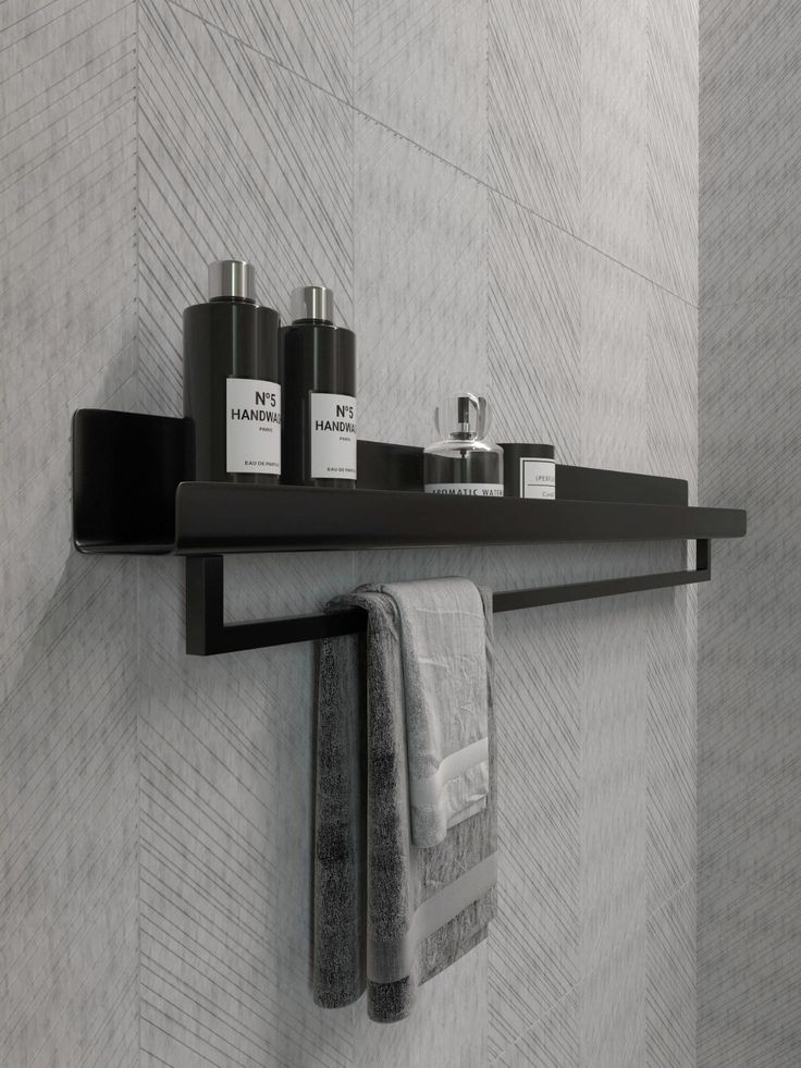 Minimalist Matte Black Wall-Mounted Bathroom Shelf with Integrated Towel Rail.