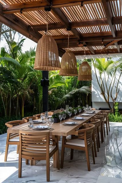 Luxurious Teak Outdoor Dining Set for 12 with Woven Rattan Pendants and Tropical Pergola.