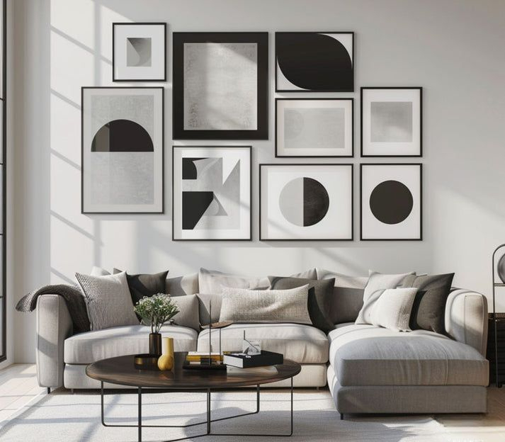  Contemporary Monochrome Living Space with Modular Gallery Wall and Dark Wood Circular Coffee Table.