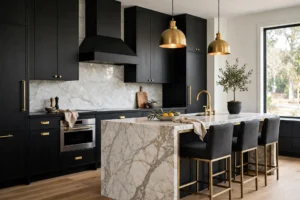 Elegant black kitchen with matte cabinets, brass accents, and marble island