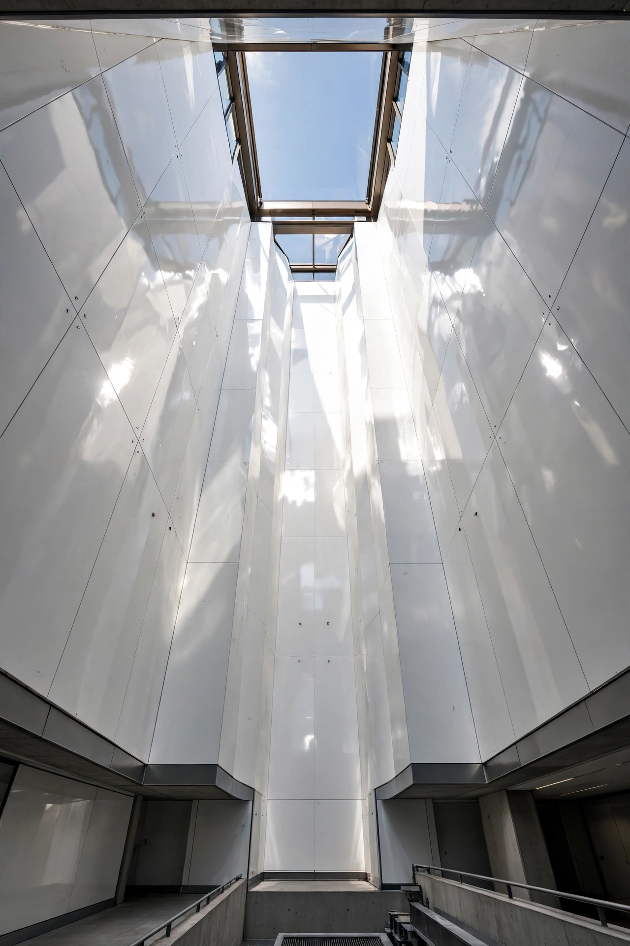 Deep splayed skylight light well with white reflective sides