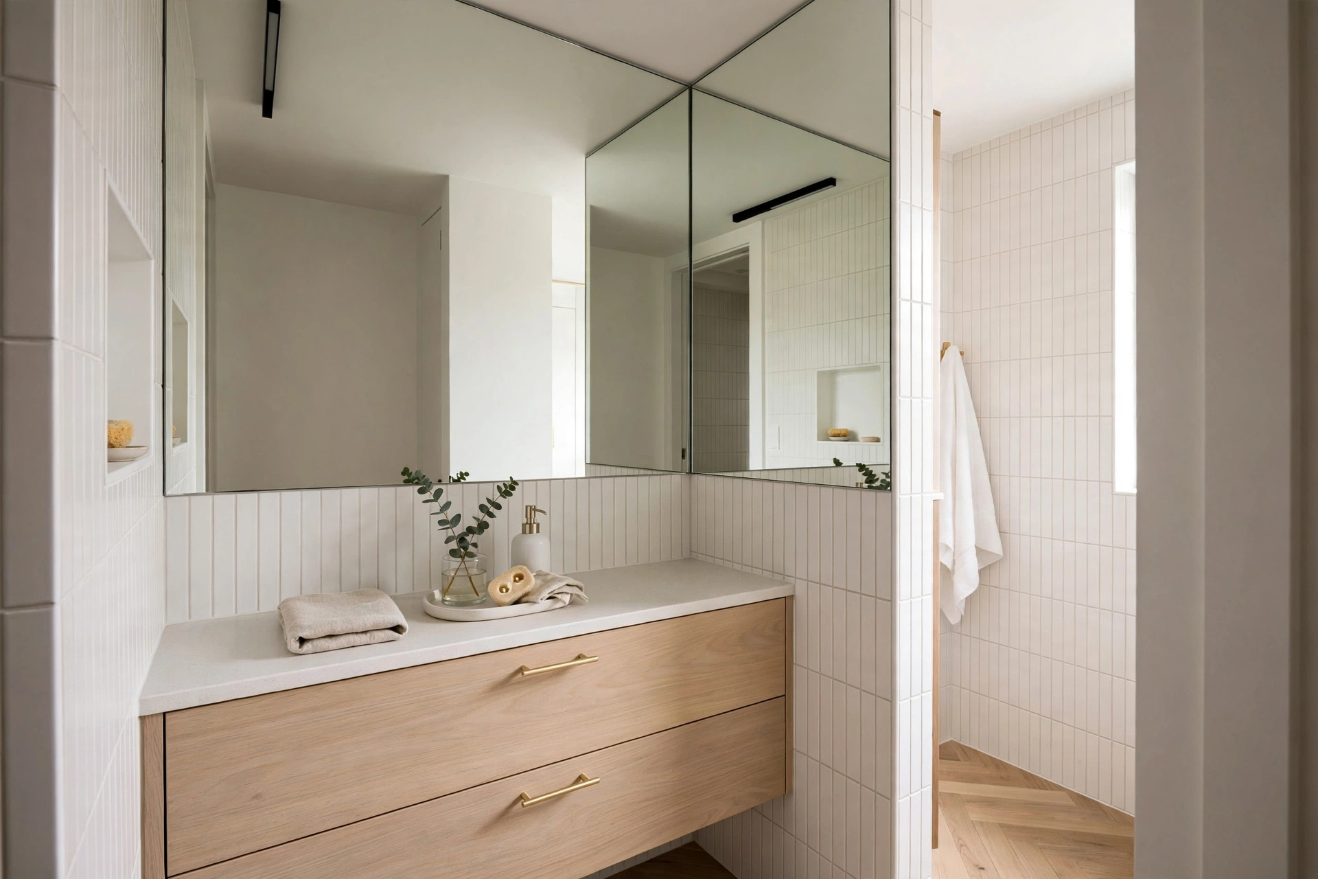 Narrow small-space bathroom vanity with full-width mirror and light finish